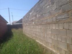 участок 10 сот с недостроенным домом